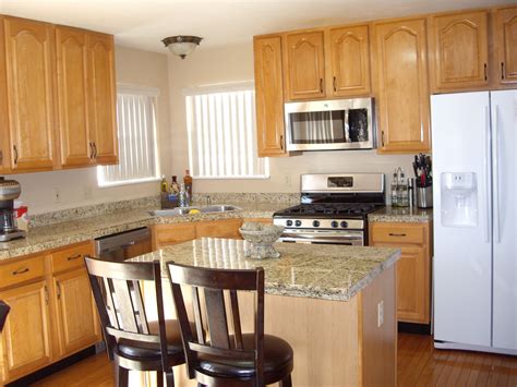 maple cabinets stainless steel appliances blue corian|maple wood kitchen cabinet flooring.